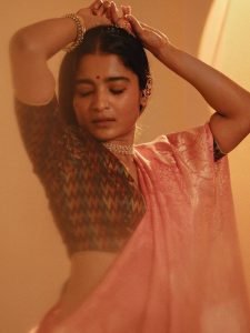 Pearl choker necklace detail on Chaithra J Achar elegant portrait