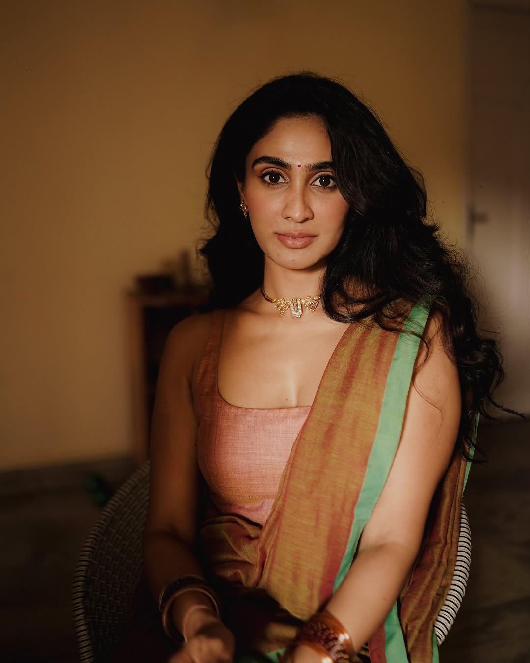 Dramatic indoor shadows on Deepti Sati artistic saree portrait