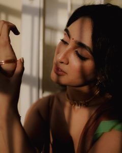 Deepti Sati contemplative expression in earthy colored silk saree