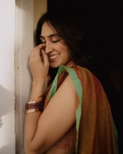 Deepti Sati contemplative expression in earthy colored silk saree