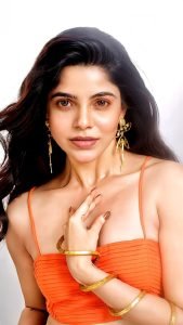 Divya Bharathi confident pose in vibrant orange corset top