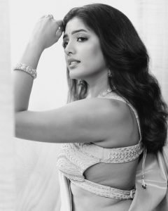 Sunlit balcony portrait of Eesha Rebba in traditional peach saree