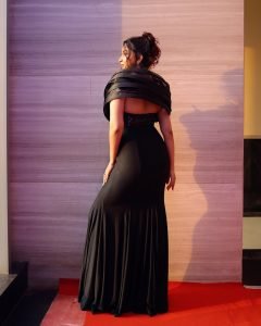 Sunset glow illuminating Eshanya Maheshwari sparkling sequin gown