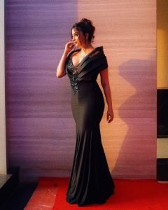 Eshanya Maheshwari elegant pose in black sequin dress golden hour