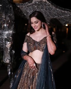 Detailed embroidery on Eshanya Maheshwari's lehenga under night lights
