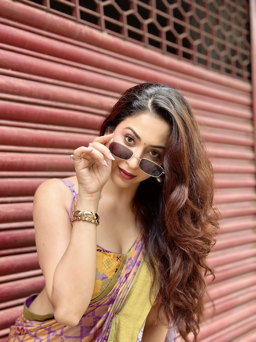 Urban backdrop showcasing Eshanya Maheshwari colorful saree look