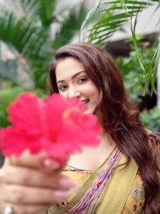 Eshanya Maheshwari walking in multicolor saree on city street