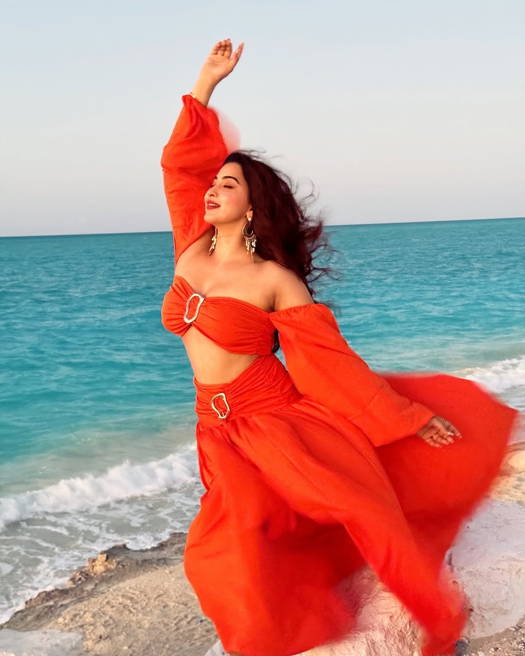 Eshanya Maheshwari orange Dress on beach twirl Lookbook (1)
