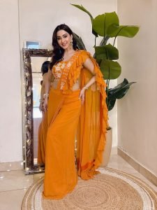 Modern ruffle detailing on Eshanya Maheshwari orange saree closeup
