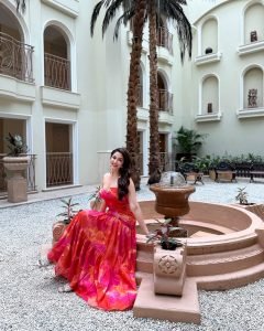 Eshanya Maheshwari stylish gaze in pink dress on modern balcony