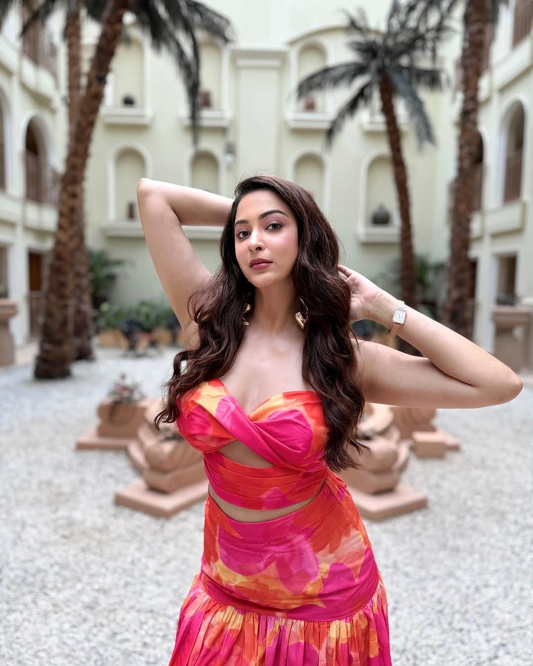 Eshanya Maheshwari stylish gaze in pink dress on modern balcony