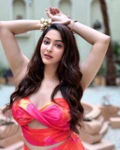 Profile shot of Eshanya Maheshwari in pink cutout dress, sunlight filtering