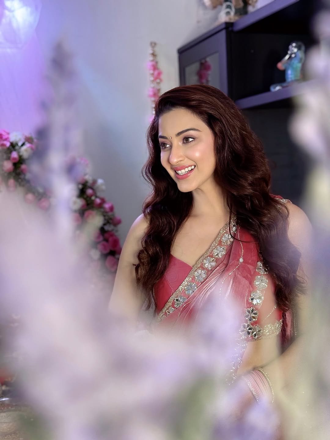 Close-up of Eshanya Maheshwari serene expression in pink saree Ganesh Puja