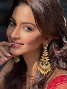 Eshanya Maheshwari twirling in red lehenga on sunny balcony