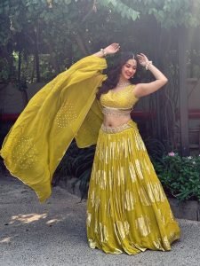 Intricate mirror detailing on Eshanya Maheshwari bright yellow lehenga