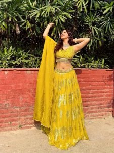 Eshanya Maheshwari confident pose in modern yellow lehenga styling