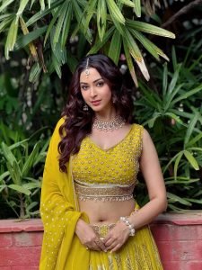 Eshanya Maheshwari confident pose in modern yellow lehenga styling
