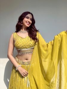 Eshanya Maheshwari confident pose in modern yellow lehenga styling