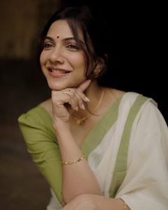 Natural portrait of Madonna Sebastian in white green bordered saree