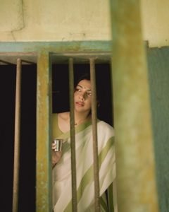 Traditional green border detail on Madonna Sebastian white saree