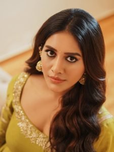 Nabha Natesh gentle expression in soft-focused mustard ethnic dress