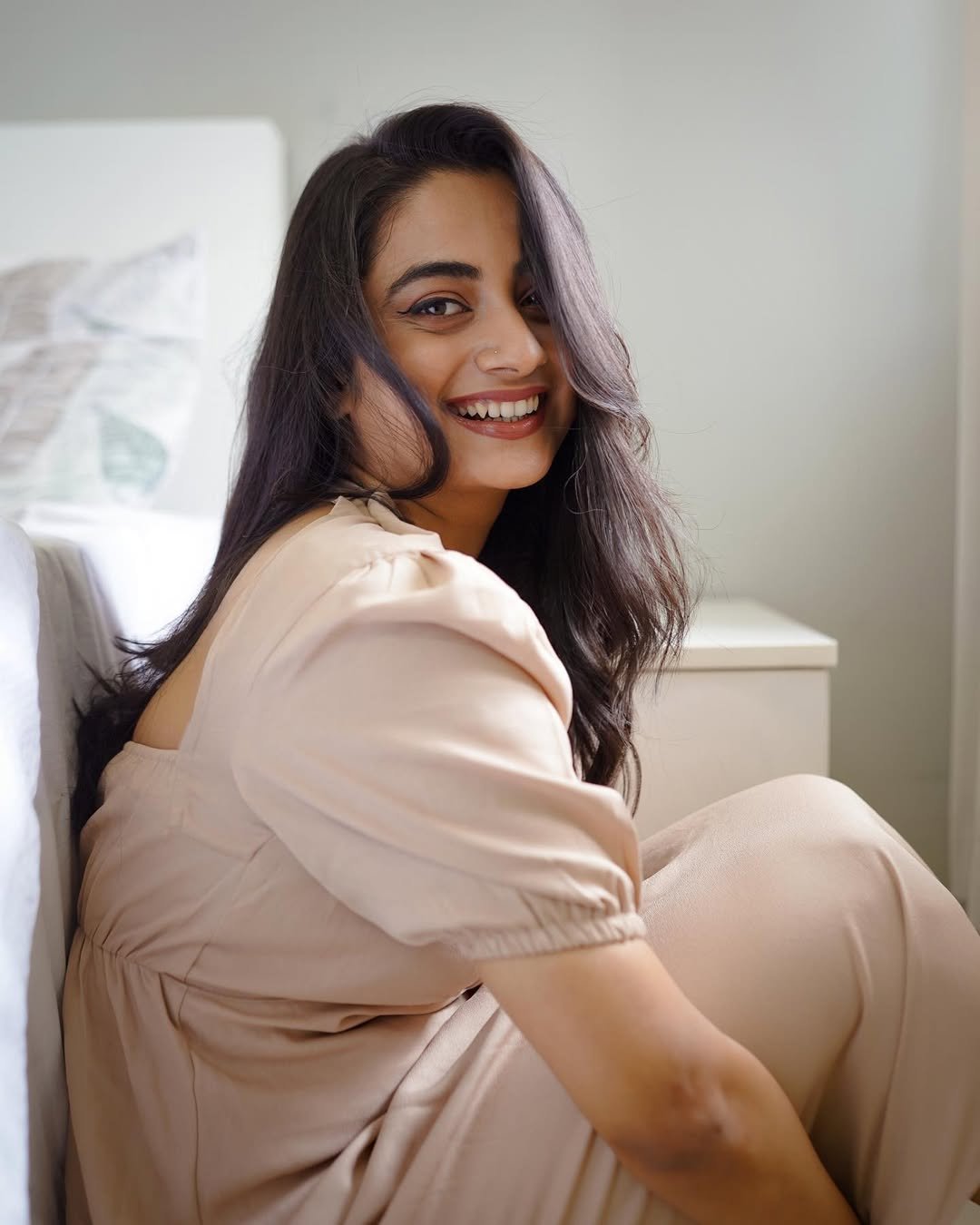 Namitha Pramod beige open back dress soft glance Photos (1)