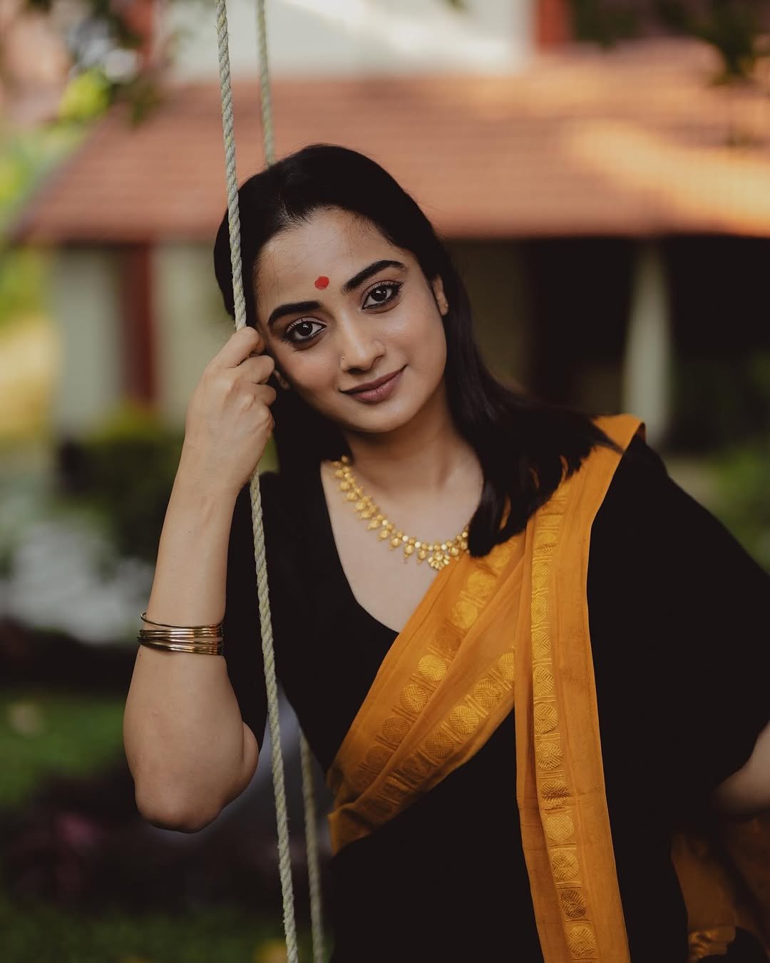 Namitha Pramod black saree mustard border swing glance Photos (18)