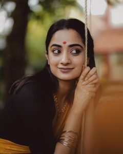 Namitha Pramod playful glance in contrasting border saree