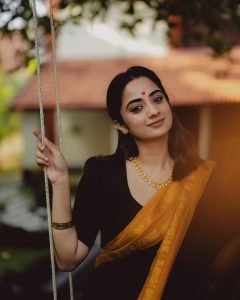 Dynamic movement of Namitha Pramod black and mustard saree