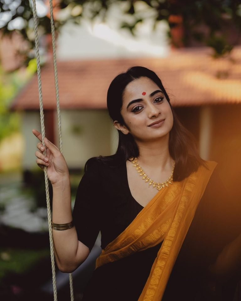 Dynamic movement of Namitha Pramod black and mustard saree
