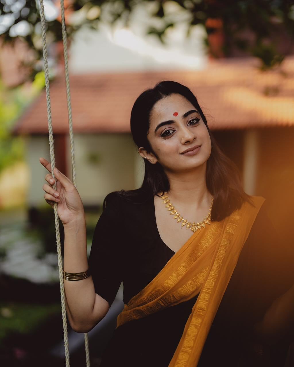 Dynamic movement of Namitha Pramod black and mustard saree