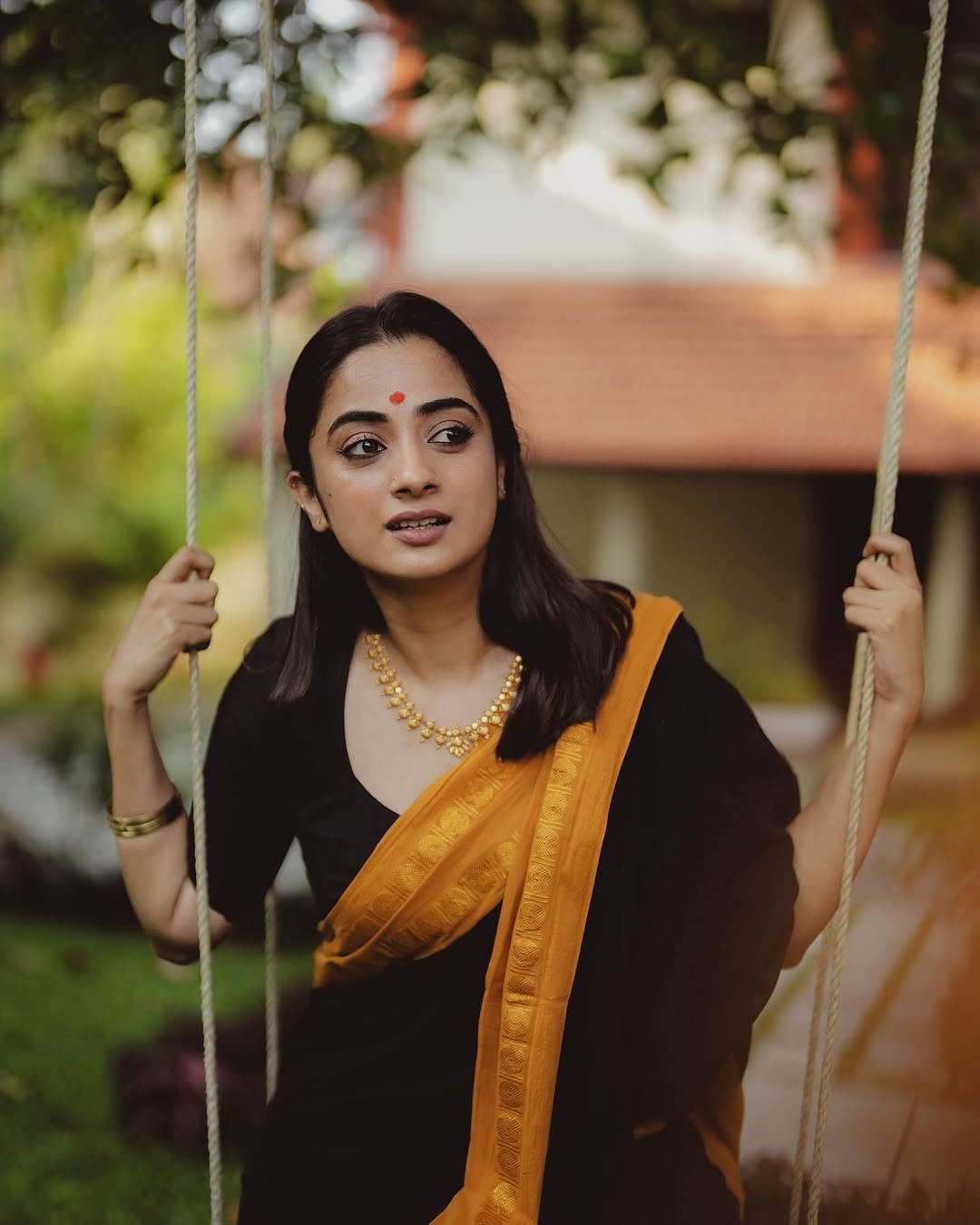 Namitha Pramod black saree mustard border swing glance Photos (8)