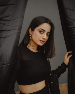 Namitha Pramod confident stance in dramatic black sheer lehenga