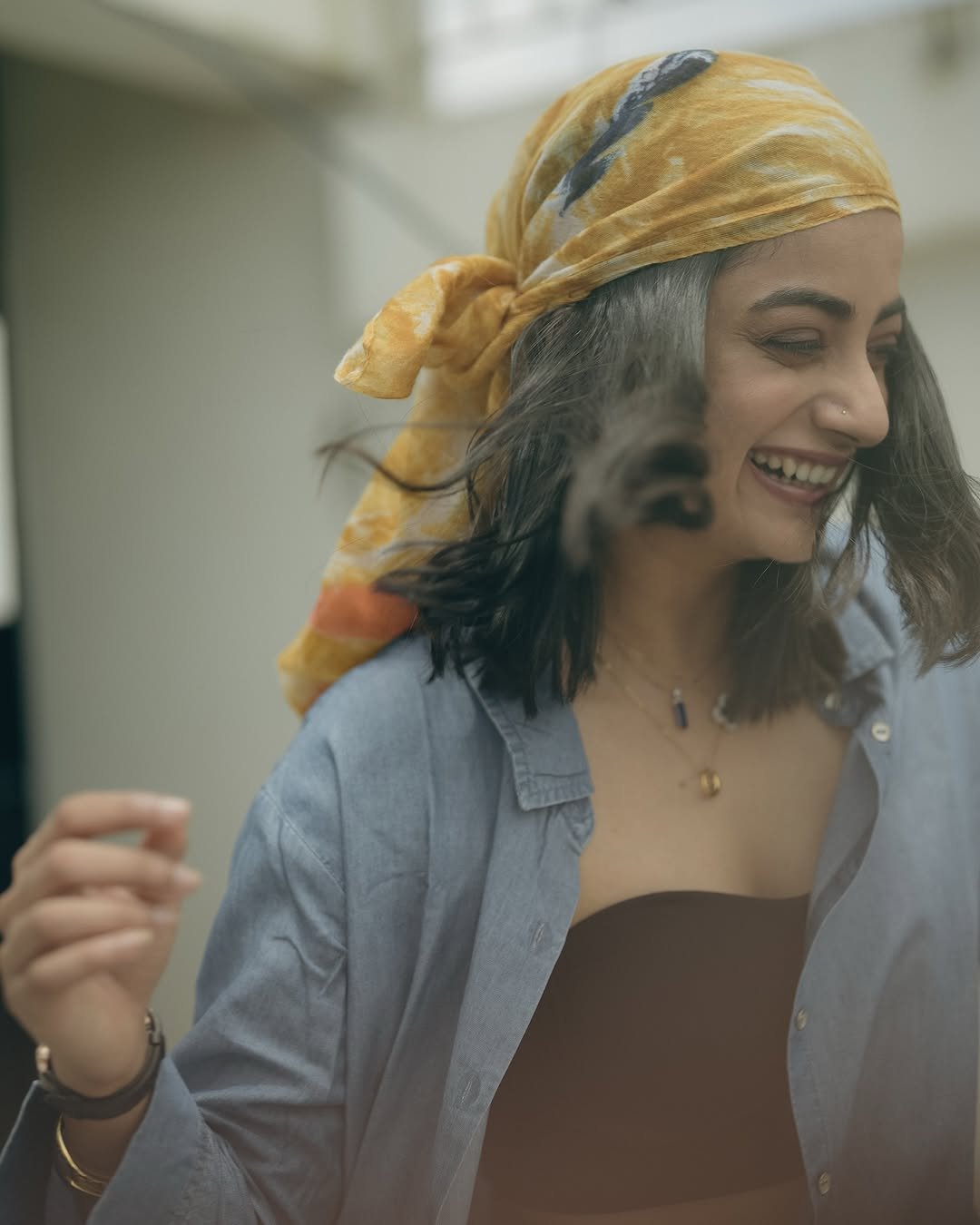 Namitha Pramod denim co-ord black bustier bandana rooftop steps Photoshoot (13)