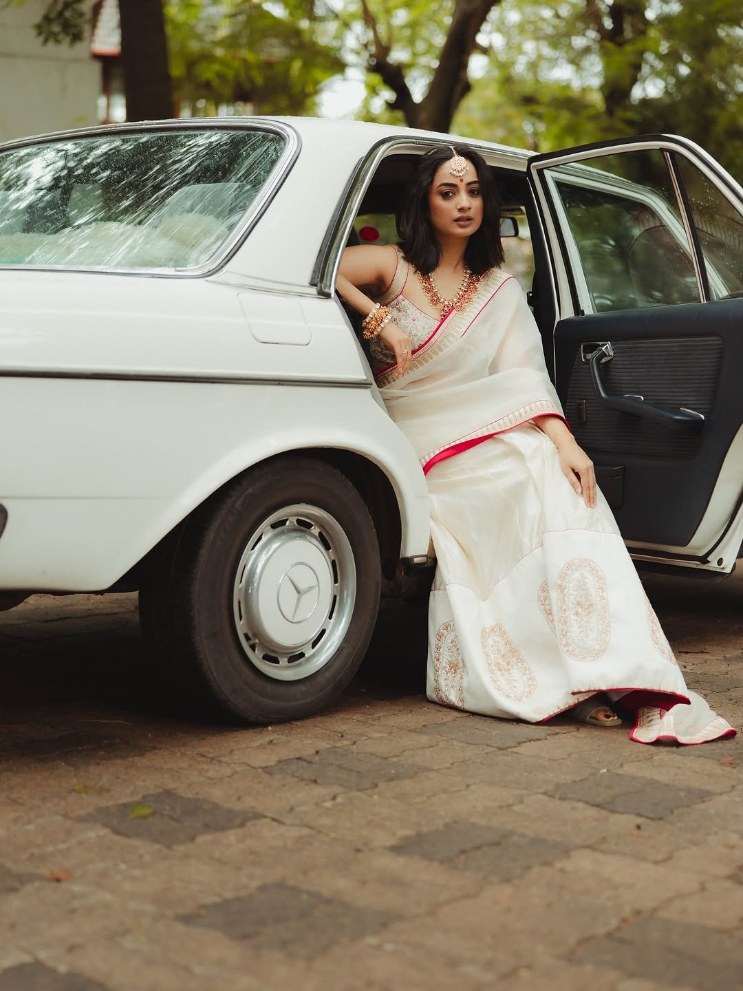 Namitha Pramod ivory saree rose-gold jewelry car cabin Portrait (13)