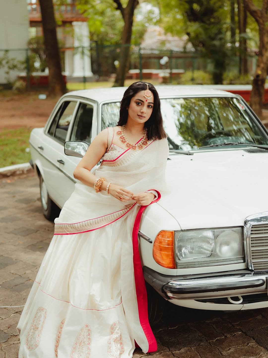 Namitha Pramod ivory saree rose-gold jewelry car cabin Portrait (30)