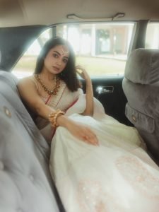 Namitha Pramod sophisticated pose in car cabin ivory saree look