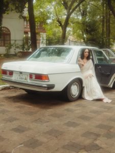Namitha Pramod sophisticated pose in car cabin ivory saree look