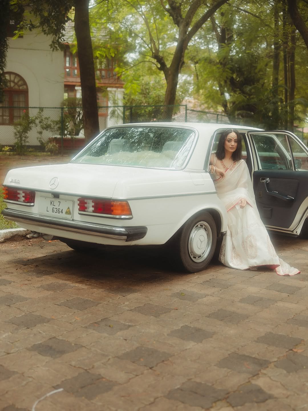 Namitha Pramod ivory saree rose-gold jewelry car cabin Portrait (5)