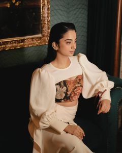 Retro furniture backdrop with Namitha Pramod ivory blouse styling