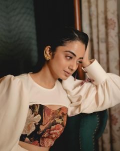 Namitha Pramod elegant pose in vintage interior wearing statement blouse