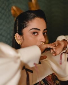 Namitha Pramod elegant pose in vintage interior wearing statement blouse