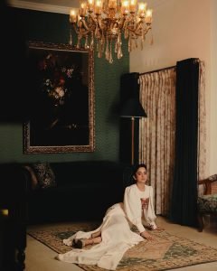 Namitha Pramod elegant pose in vintage interior wearing statement blouse