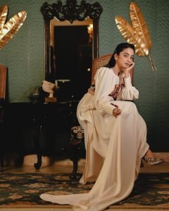 Retro furniture backdrop with Namitha Pramod ivory blouse styling