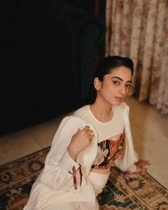 Retro furniture backdrop with Namitha Pramod ivory blouse styling