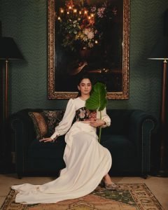 Namitha Pramod elegant pose in vintage interior wearing statement blouse