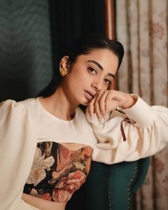 Namitha Pramod elegant pose in vintage interior wearing statement blouse