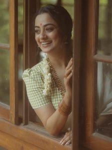 Soft window light creating glow on Namitha Pramod classic look