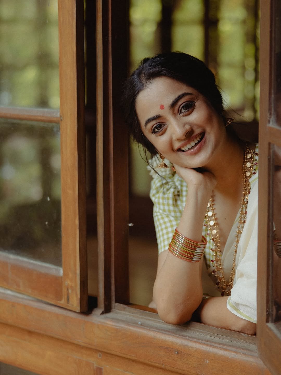 Namitha Pramod jasmine gajra white saree window-light smile Photoshoot (10)