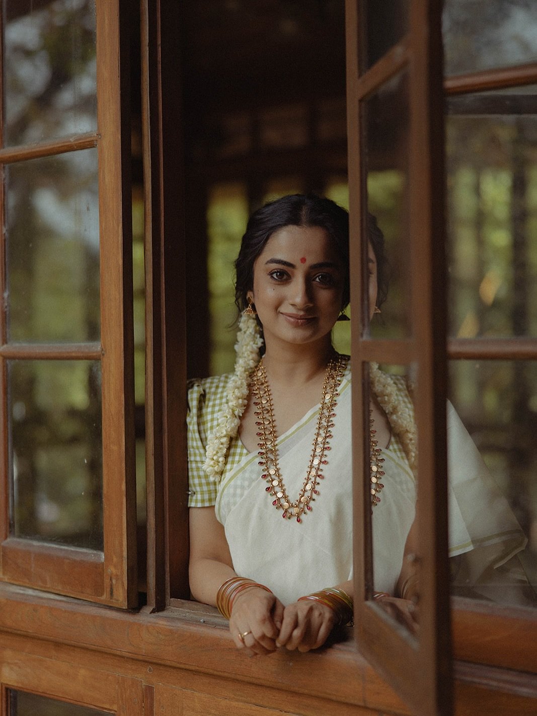 Natural window lighting on Namitha Pramod traditional jasmine flowers